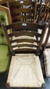 Two rush seated ladder back chairs