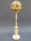 A large ivory puzzle ball with carved dragon decoration,