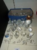 A collection of Swarovski crystal animals to include dolphins, whale, cats, dogs, rhino, elephant,