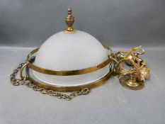 A brass and glass hanging ceiling lamp.