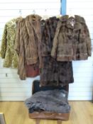 Five fur and faux fur coats to include full length example by Selfridges and a faux leopard example