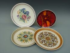 Four plates, two by Langley and two Poole one with floral design, the other Delphis, largest approx.