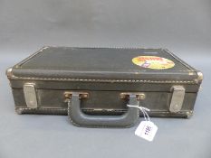 A cased Bundy composite clarinet by the Selmer Company USA, includes a selection of spare reeds,