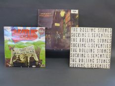 Three cases of albums including David Bowie, Beatles,