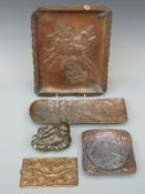 A collection of Japanese brass and bronze trays with Samurai decoration together with a figure,