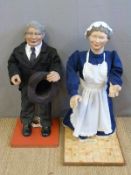 A pair of shop display animations of a kitchen maid in Edwardian style outfit and a gentleman