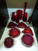 A collection of Whitefriars and similar ruby glassware including a textured bark dish,
