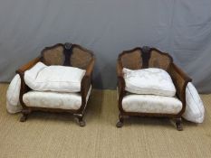 A 19thC/20thC bergere three piece suite with loose cushions,