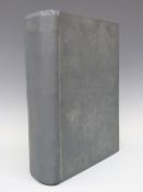 A book containing linen backed maps of England with county maps, the railways,