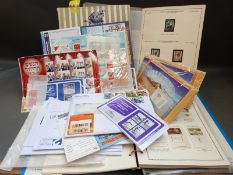 A mint collection of Israel stamps in two albums plus packets of mint stamps and an album of