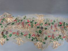 A 19thC straw work embroidered organdie border, possibly removed from garments,