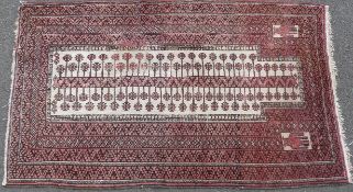 A late 19thC Turkoman rug with emblematic tree of life central gul and two Hands of Fatima guls ,