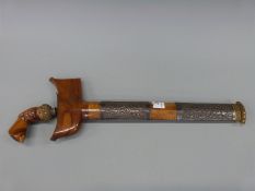 A Kris dagger in wooden scabbard,