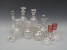 A collection of seven cut glass decanters,