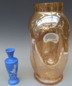 A large Whitefriars style dimple glass vase and a blue glass vase with Mary Gregory style