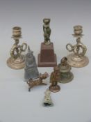 A pair of cast metal figural chambersticks, an Indian brass figure of a traveller,