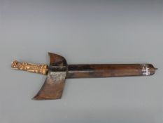 A late 19thC/20thC Kris dagger with a carved bone handle in the form of a mythical creature,