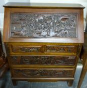 A carved Chinese bureau with fitted interior and front drawers (H112 x W88 x D39cm)
