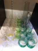 A collection of drinking glasses and a jug
