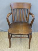 A mahogany captain's or office chair.