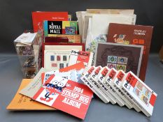 A large quantity of loose stamps, catalogues,