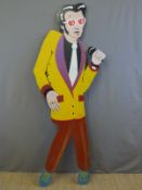 A life sized storefront advertising figure of Elvis with Jean Jeannie motif.