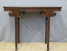 A 19thC/20thC Chinese hardwood altar table with typical scrolling detail,