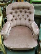 A 19thC upholstered armchair