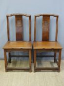 A pair of Chinese elm chairs