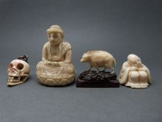 A Japanese carved skull, a Buddhist carving,