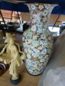 A floor vase decorated with flowers together with an ivory style figure and a collection of