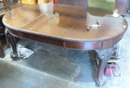 A Victorian mahogany table raised on ball and claw feet with extra leaf and winder (H77 x max L 235