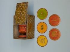 Seventy six circular 18thC/19thC Persian playing cards in a period lacquer box