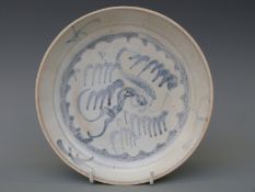 A Chinese blue and white dish, from the Tek Sing cargo wreck of 1822, decorated in phoenix pattern,