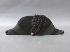 A late 18th/early 19thC man's silk bicorn hat, with braided silk trim, lined,