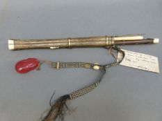 A Chinese eating set in shagreen sheath comprising knife, chopsticks and a further tool,