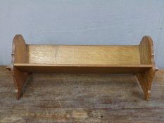 An Arts and Crafts peg jointed oak book trough,