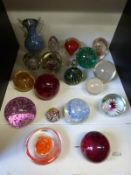 Twenty various glass paperweights including Mdina together with a millefiore glass vase.