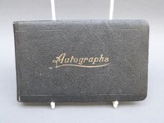 A c1930s autograph album with various sketches including church in moonlight, cartoons, swan,