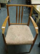 An upholstered mahogany armchair attributed to Gordon Russell