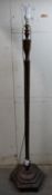 An octagonal mahogany standard lamp