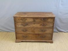 A Georgian mahogany chest of two over three graduated drawers raised on bracket feet (H63 x W118 x