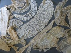 A collection of 19thC lace, kid gloves, child's leather shoes etc.