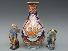 A 19thC Japanese Imari baluster vase and two figures