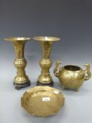 A pair of Chinese brass vases on stands and two similar style items,