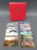 An album of early 20thC and later cat related postcards and a collection of novelty 3D cards.