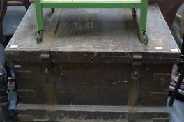 A 19thC metal bound stained pine silver chest/trunk with metal looped handles,