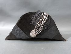 A late 18th/early 19thC man's beaver fur bicorn hat, with silk moiré & cut steel trim,