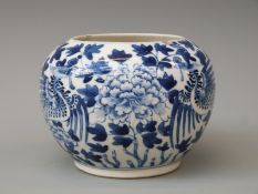 A Chinese blue and white pot decorated with a phoenix with four character mark to base,