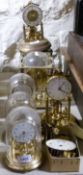 A collection of brass clocks,